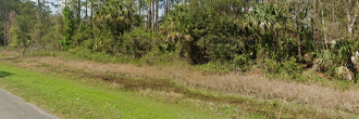 Over an acre in a quiet wooded community outside of town